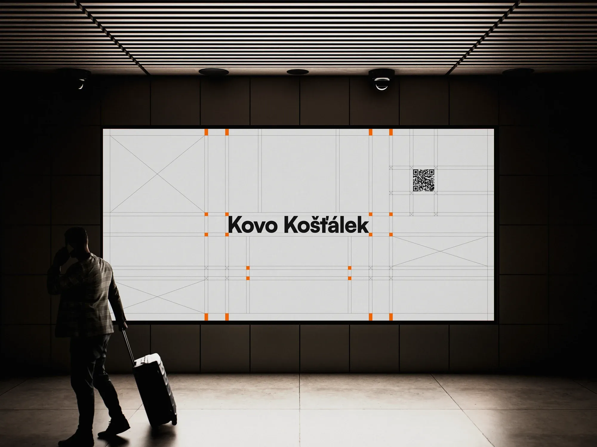 KovoKošťálek identity on a billboard in an underground passage